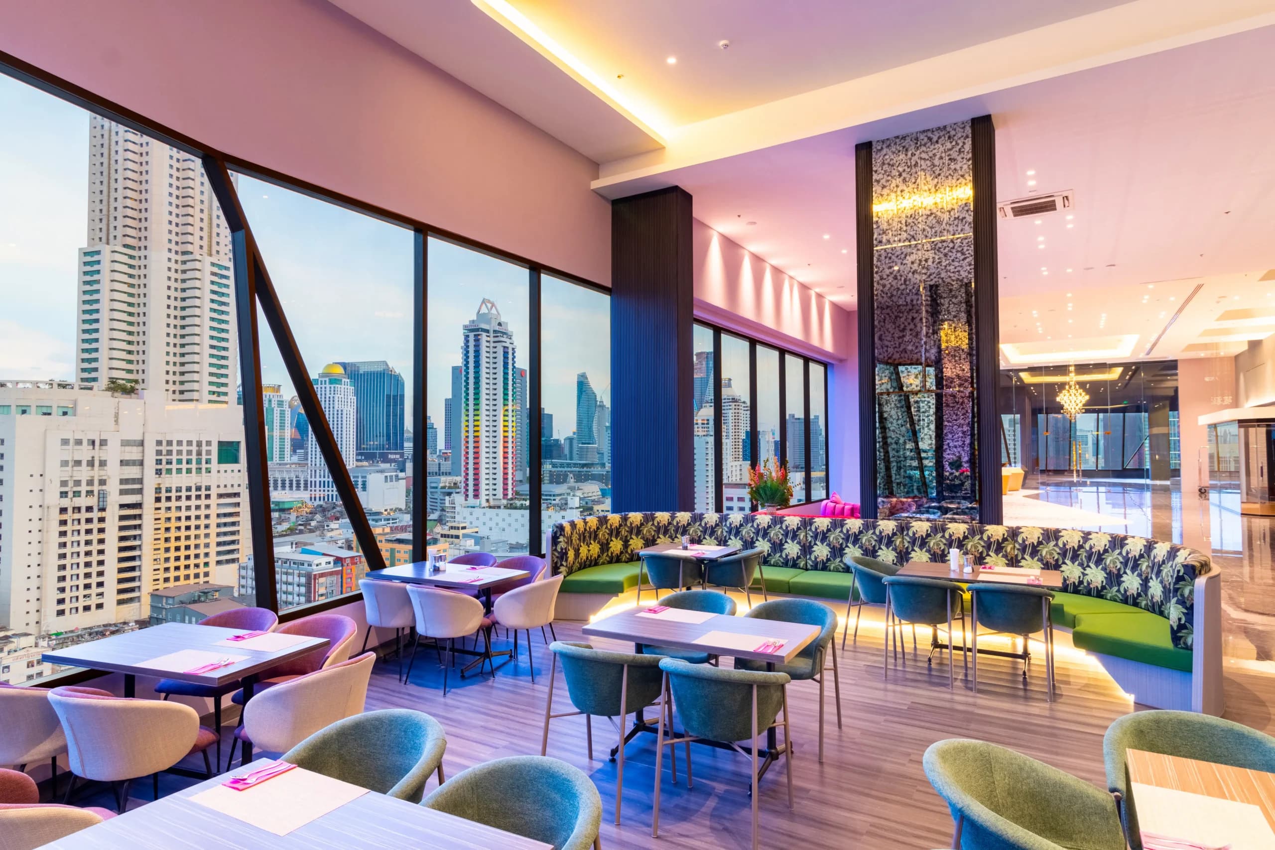 The restaurant, with floor-to-ceiling windows overlooking the skyline.