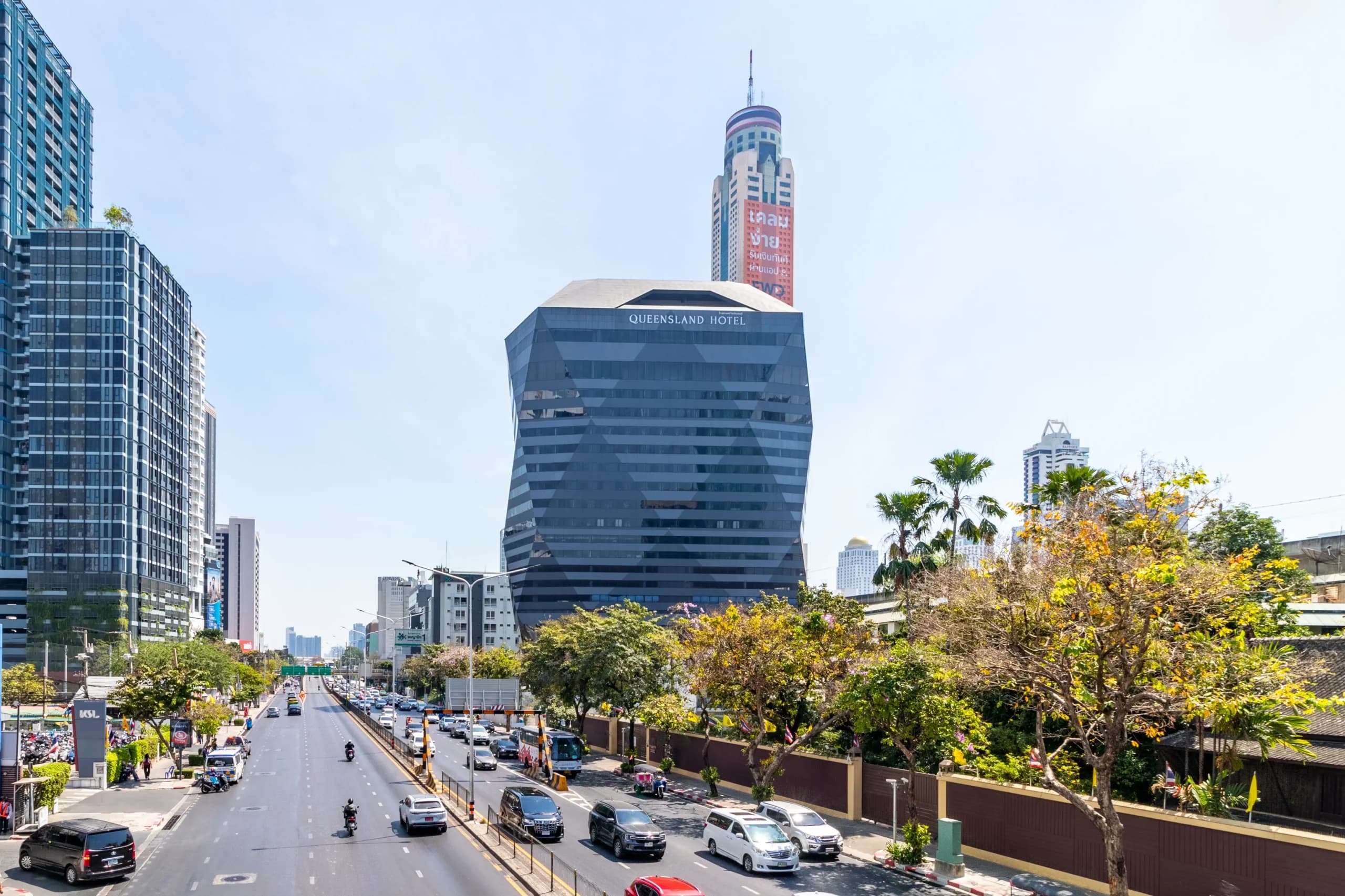 The hotel seen from the street, with Baiyoke Tower rising behind it.